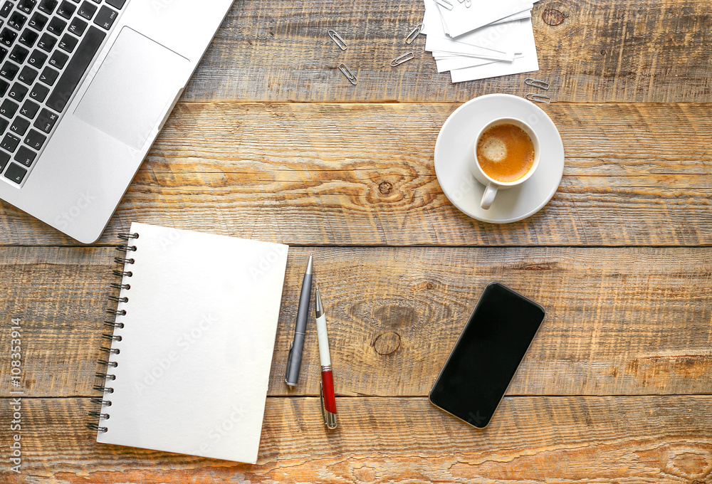 Working place with laptop on wooden table