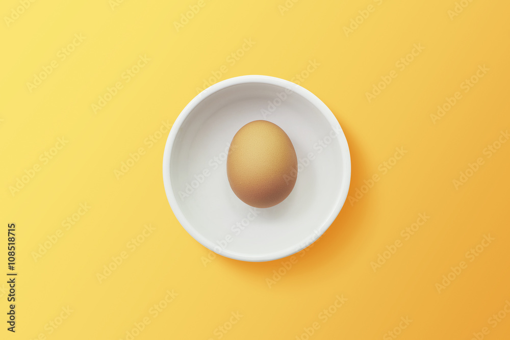 top view of egg in bowl ,orange background