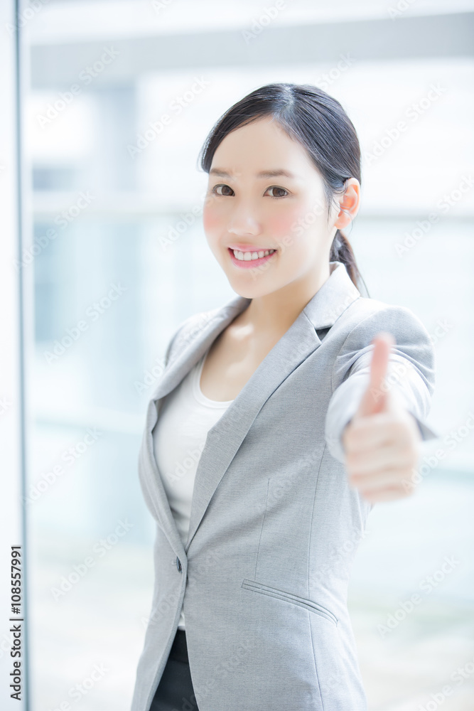 business woman show thumb up