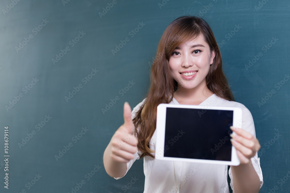 beautiful asian girl teacher with tablet and blackboard