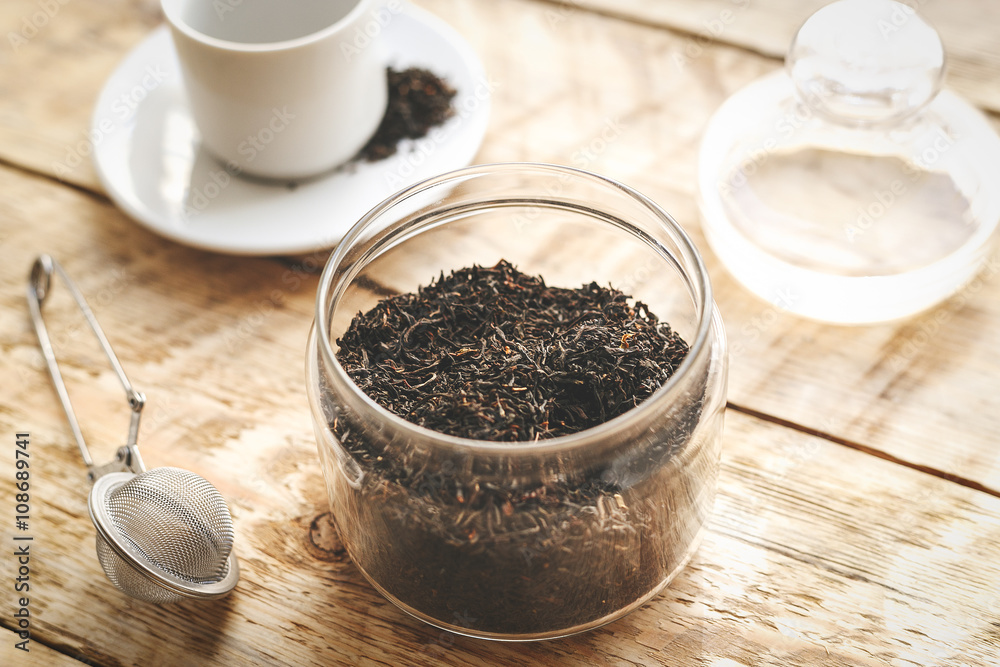 Tea set on the wooden table at sunny morning