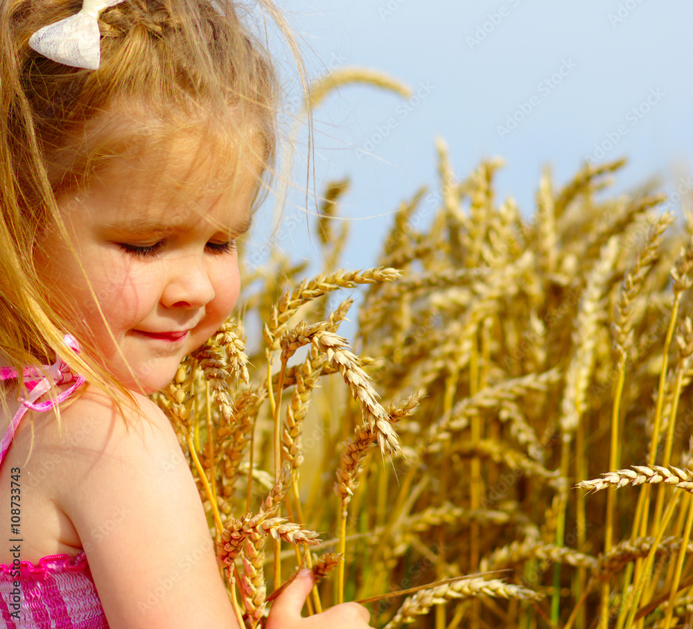 Girl on a wheat