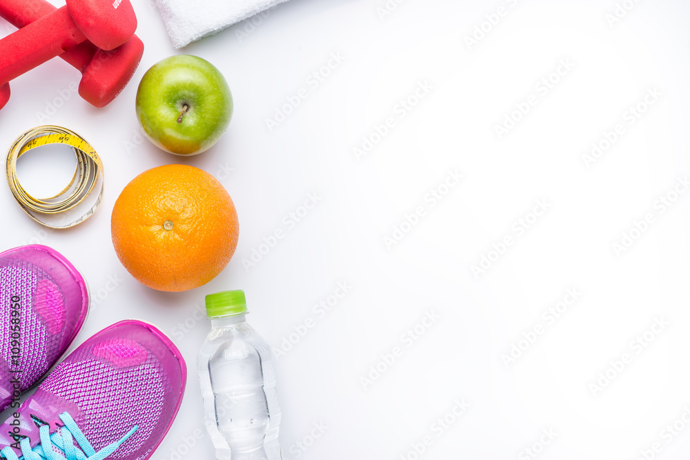 Sneakers and dumbbells fitness on a gray background. Different tools for sport