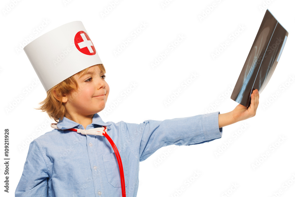 Young doctor studying an x-ray of hand