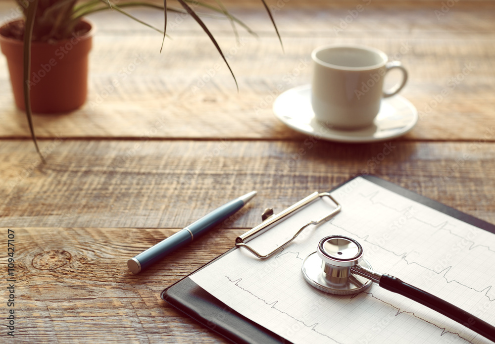 doctor workplace with a stethoscope at wooden table