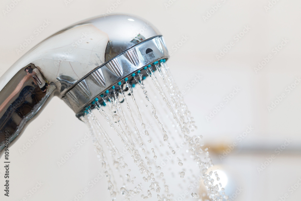 Shower with water steam in the bathroom.