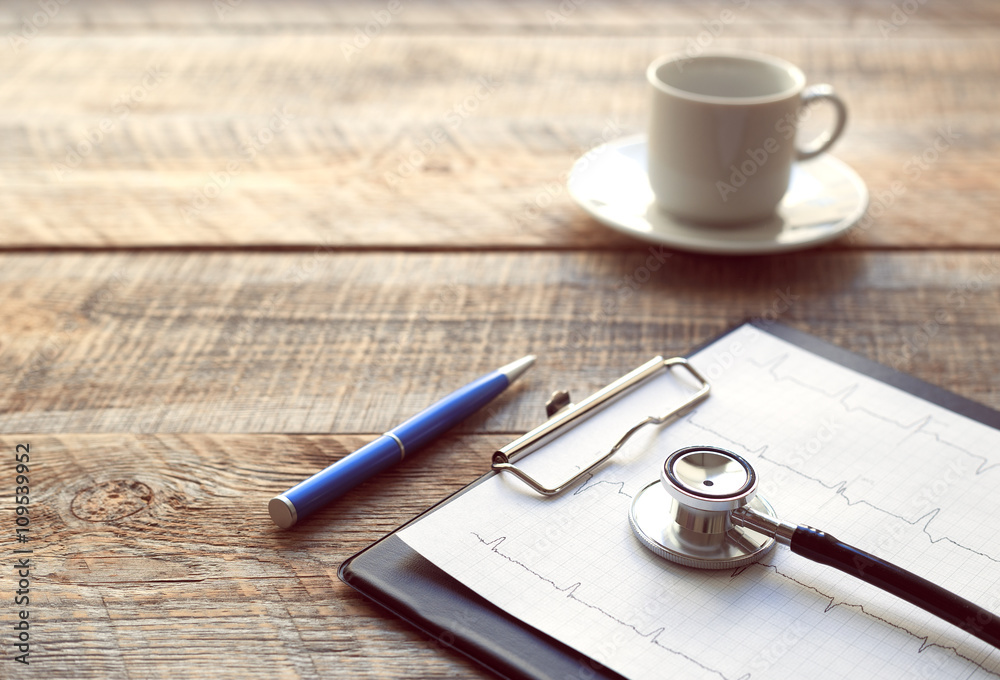 doctor workplace with a stethoscope at wooden table