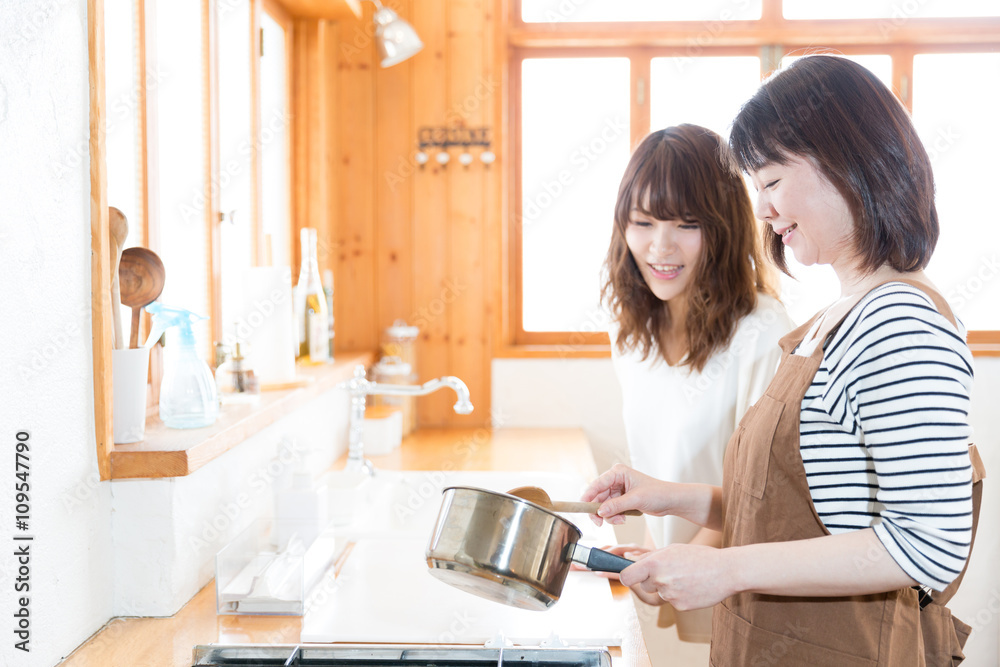 asian family cooking in the kitchen