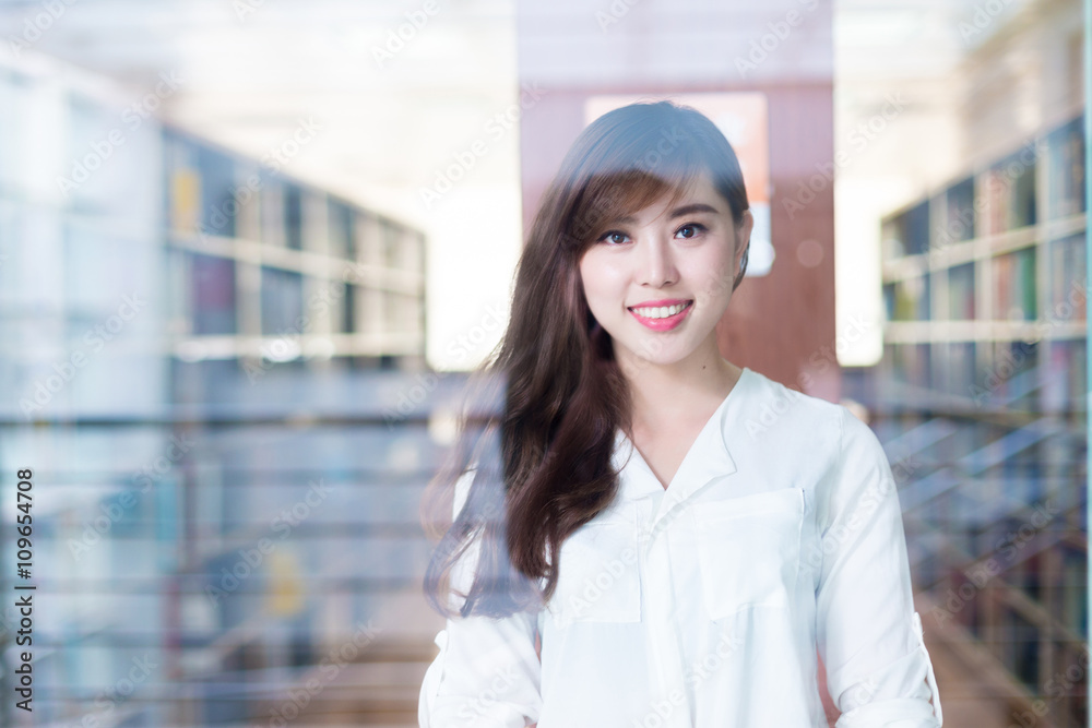 young beautiful asian girl student in library