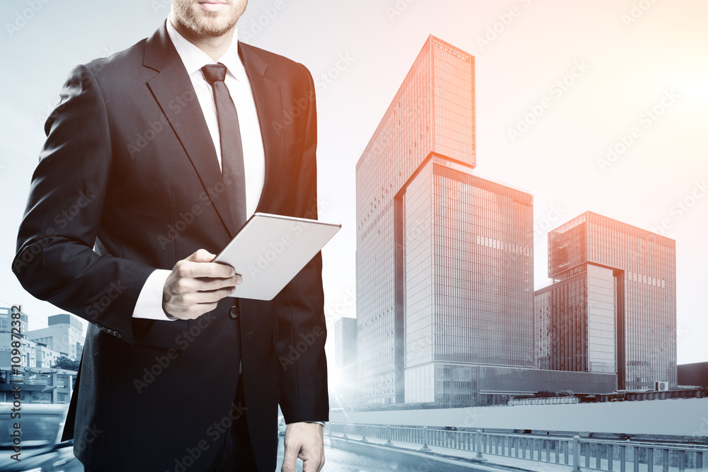 businessman with tablet on cityscape and skyline of zhuhai