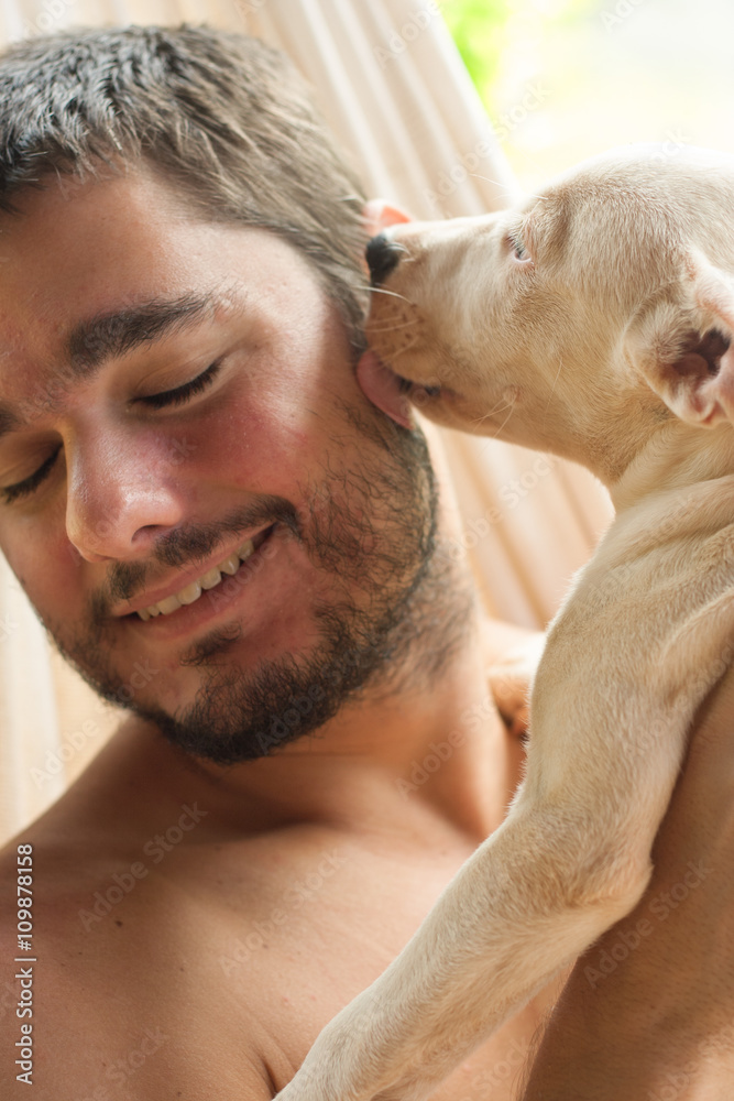 Dog licking a man