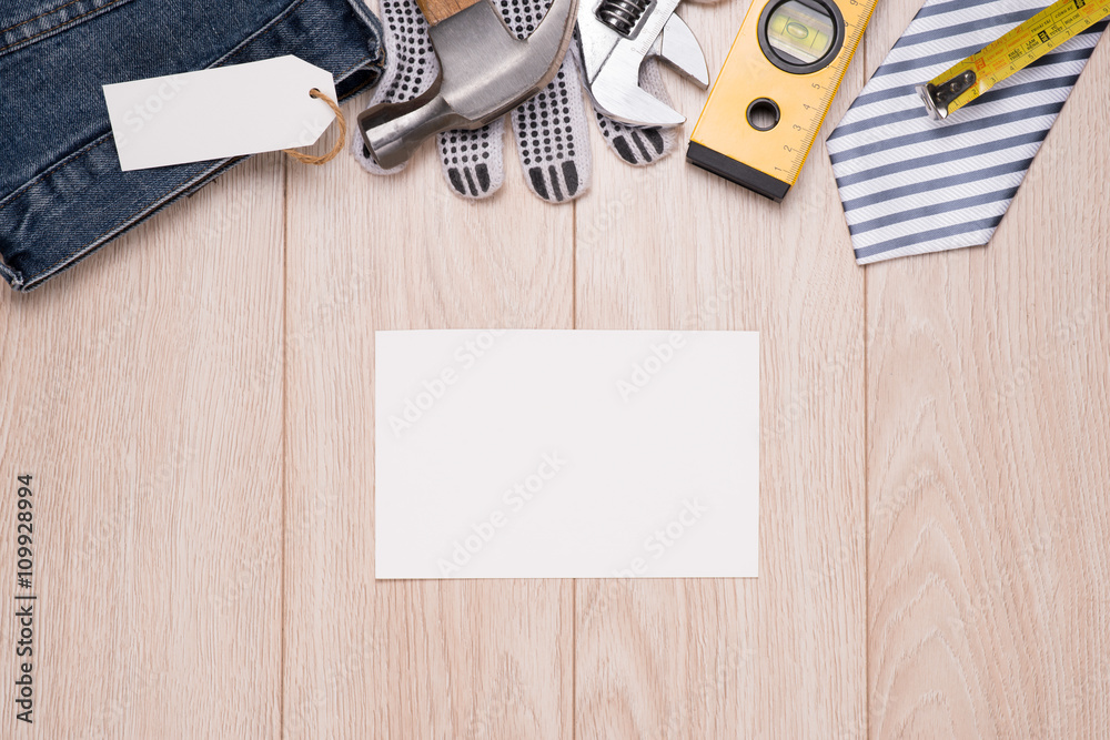 Happy Fathers Day Blank paper card with tools on a rustic wooden background