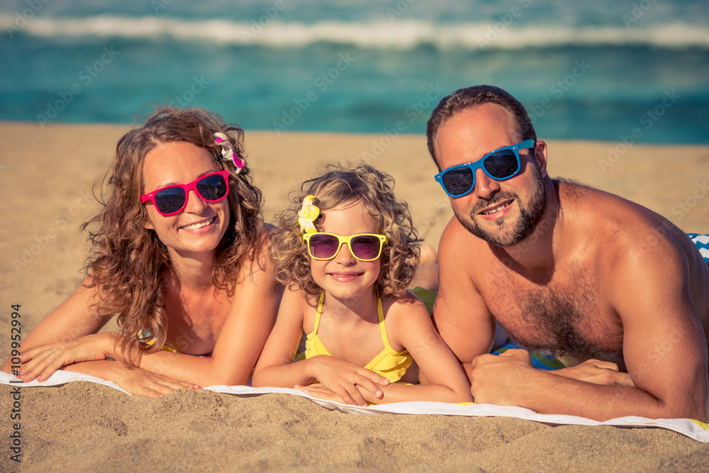 Happy family having fun on the beach