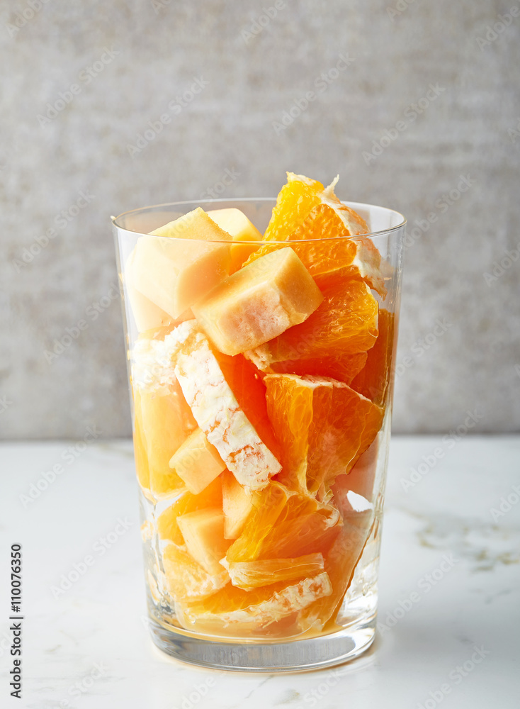 glass of fruit pieces for making smoothie