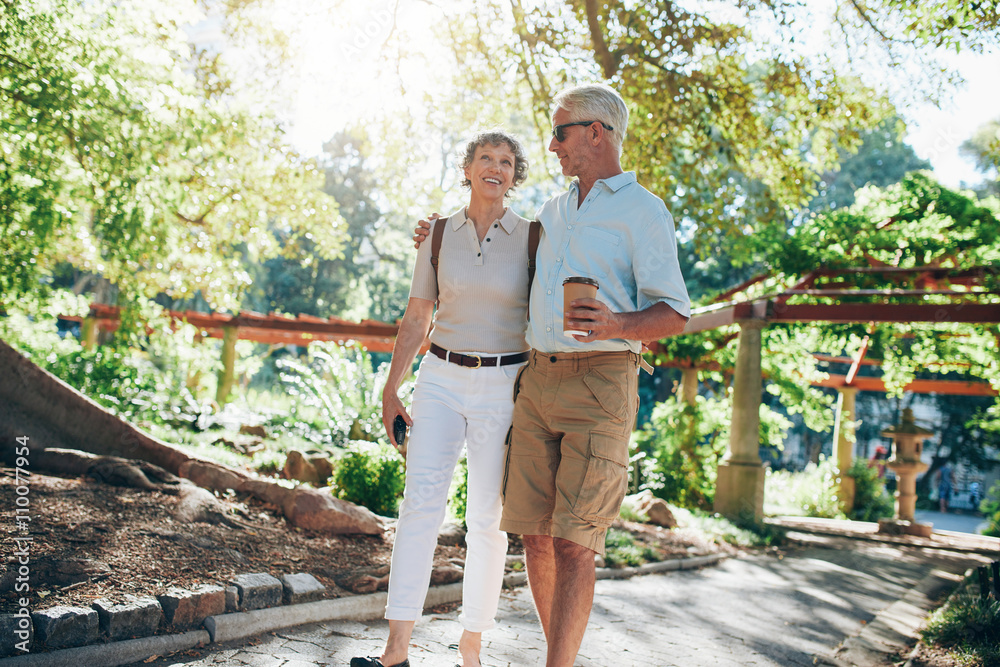 Loving senior couple enjoying a walk in the park