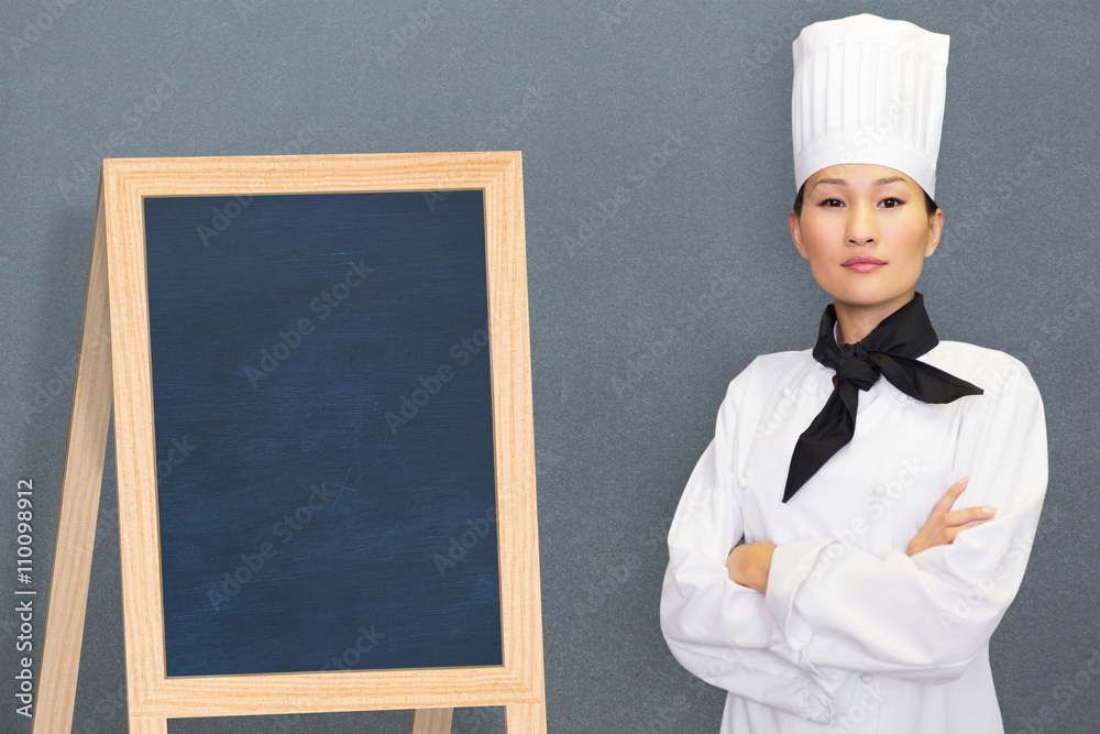 Composite image of portrait of confident female cook in kitchen