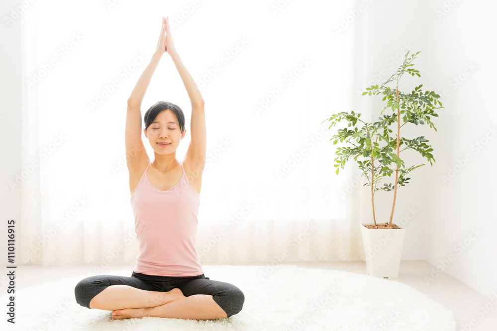 attractive asian woman exercising in the room