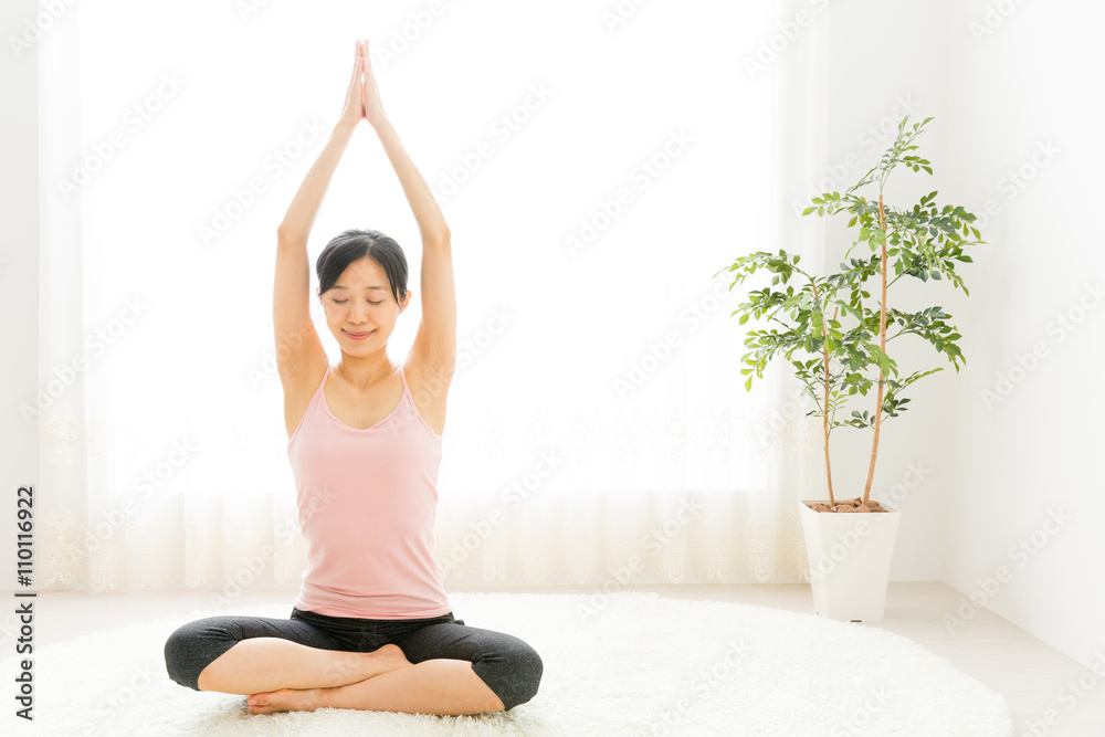 attractive asian woman exercising in the room