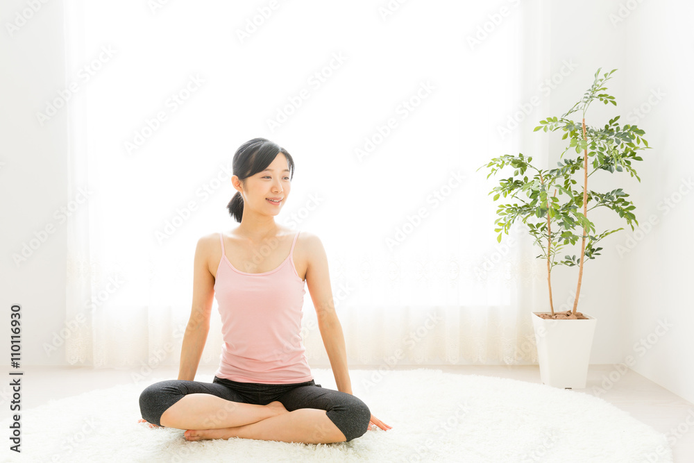 attractive asian woman exercising in the room