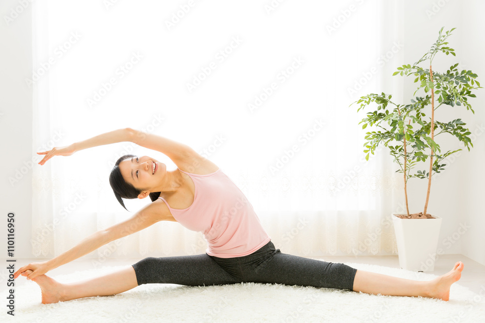 attractive asian woman exercising in the room