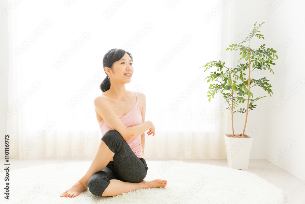 attractive asian woman exercising in the room