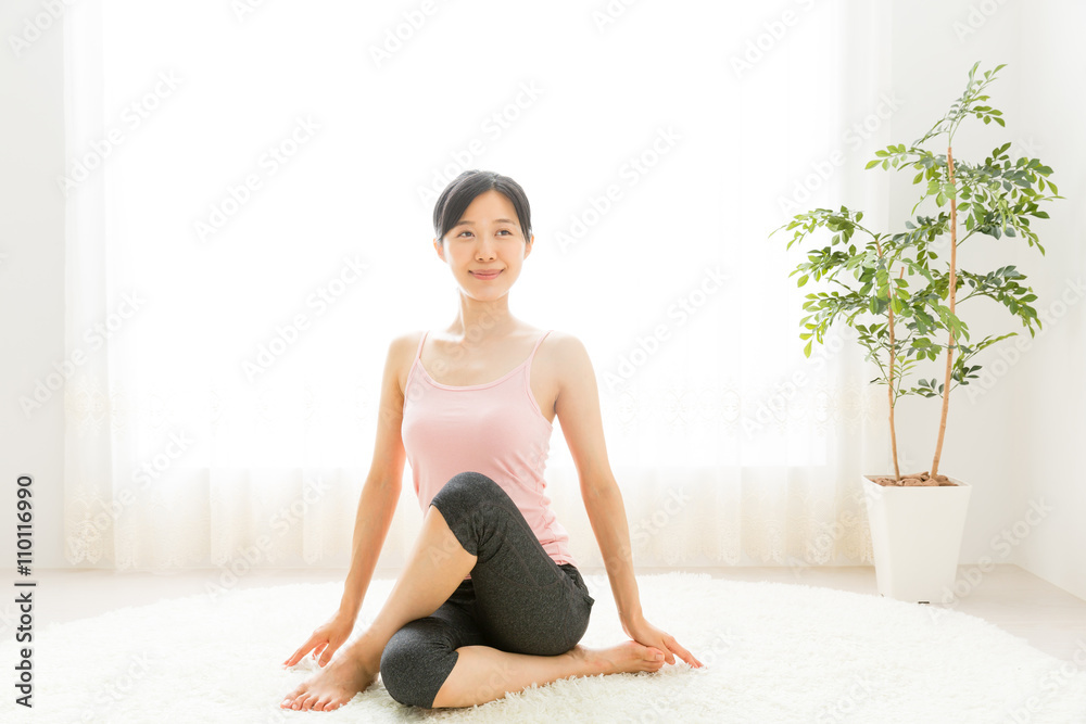 attractive asian woman exercising in the room