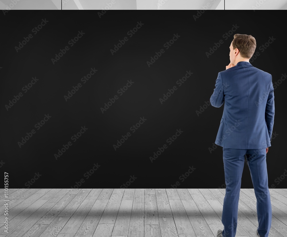 Composite image of wear view of businessman thinking 