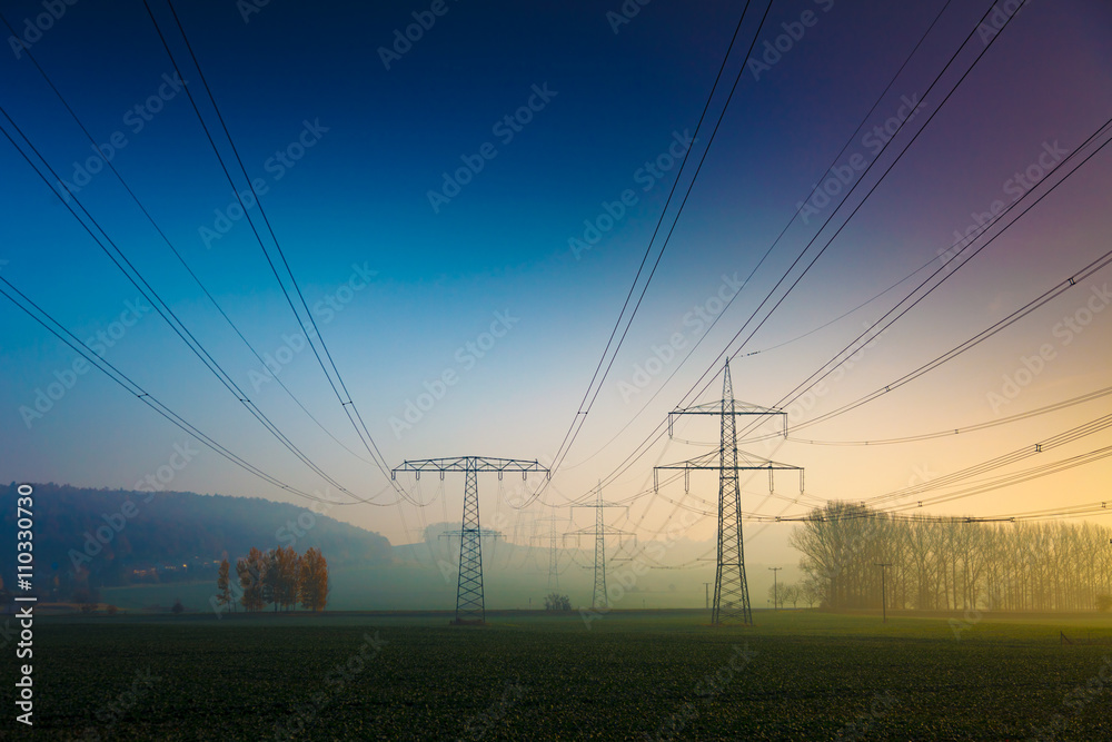 Power electric line in foggy morning