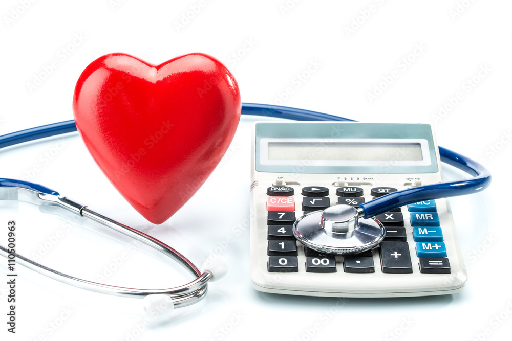 Red heart and calculator with stethoscope on white background