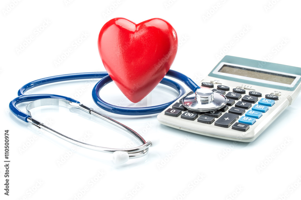 Red heart and calculator with stethoscope on white background