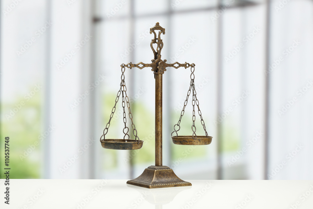 Justice Scale on white table