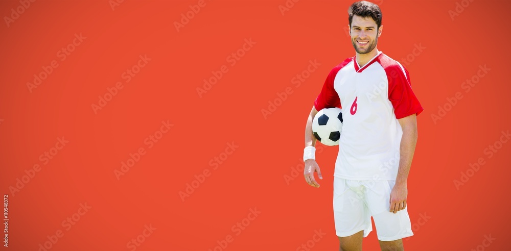 Composite image of portrait of happy football player posing and 