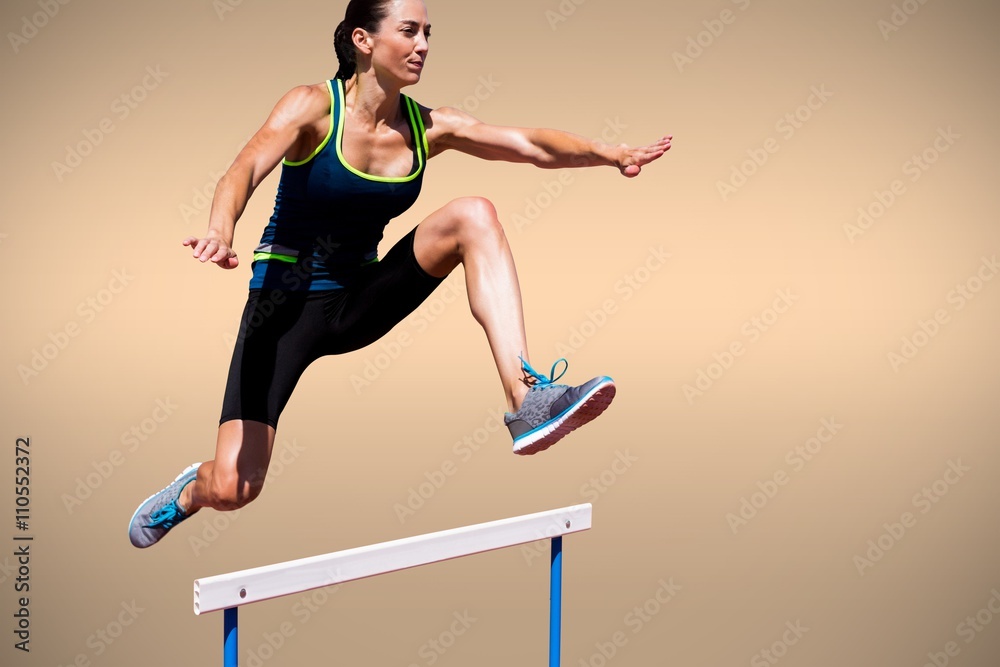 Composite image of athletic woman doing show jumping