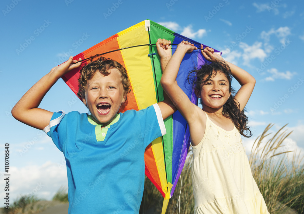 Little Girl And Little Boy Playing Kite Together Concept