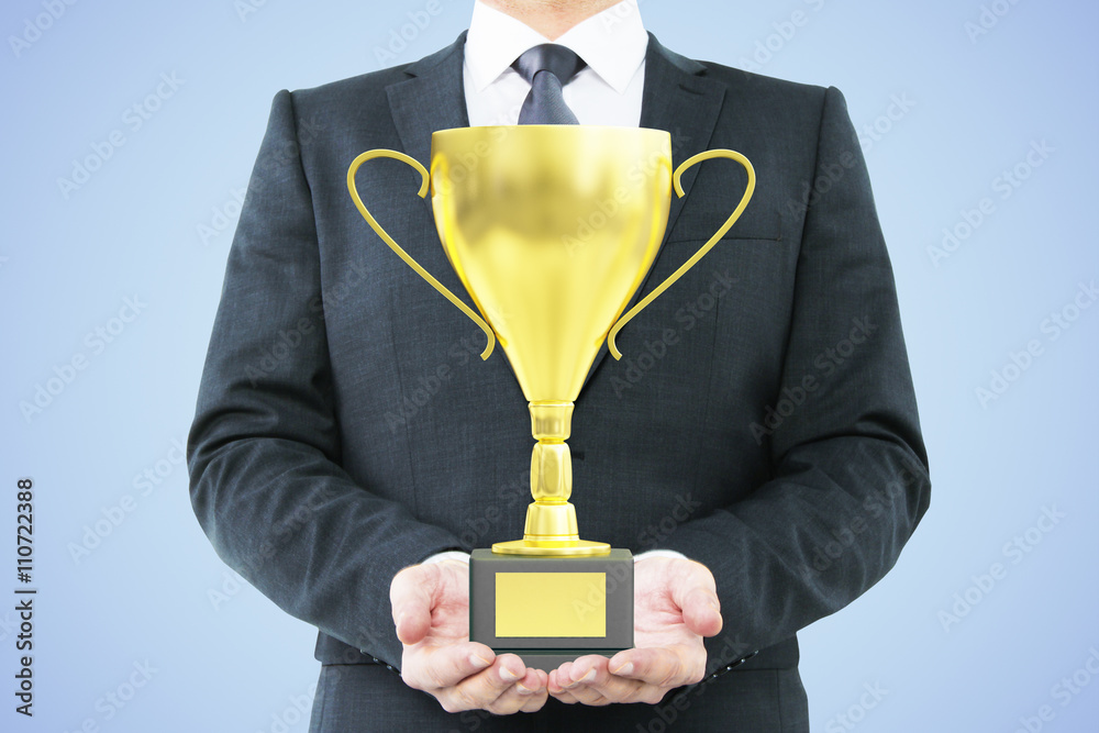 Man with trophy blue background