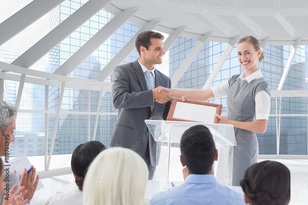 Composite image of business people handshake