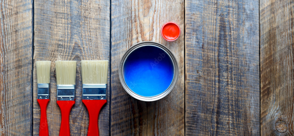 preparation for painting wooden floor at home with blue paint