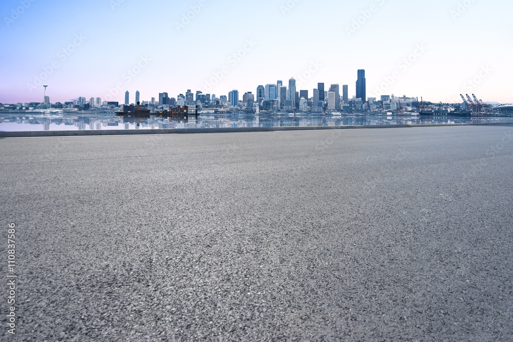 empty asphalt road with cityscape and skyline of seattle