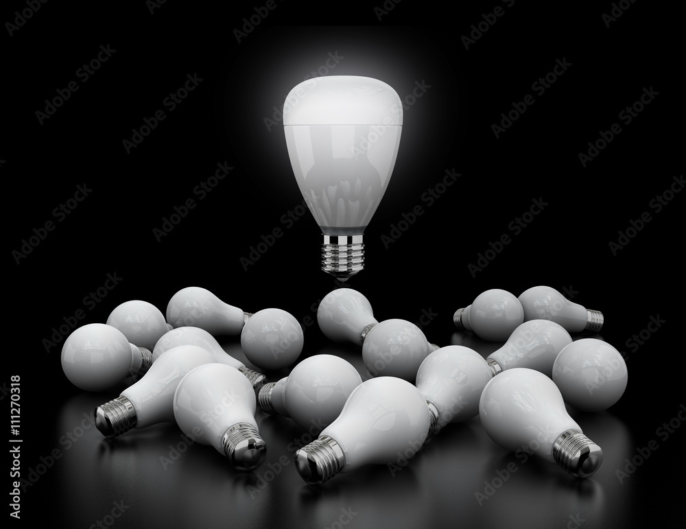 LED light bulb shining in midair, Incandescent light bulbs lay down on black ground. New light equip