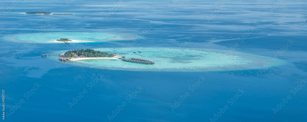 Tropical islands and atolls in Maldives from aerial view