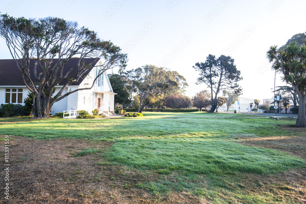 house in green grassland in sunny day