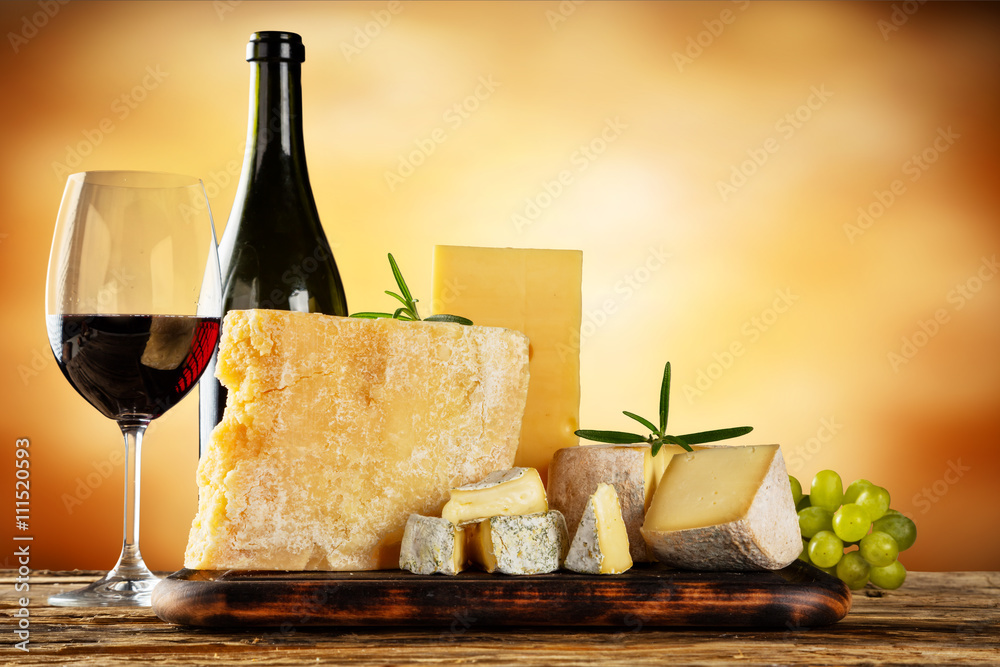 Various types of cheese with red wine