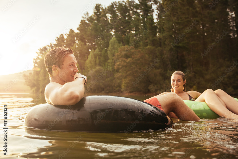 Couple relaxing in water on a summer day.