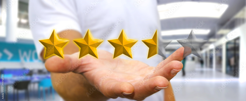 Businessman rating stars with his hand