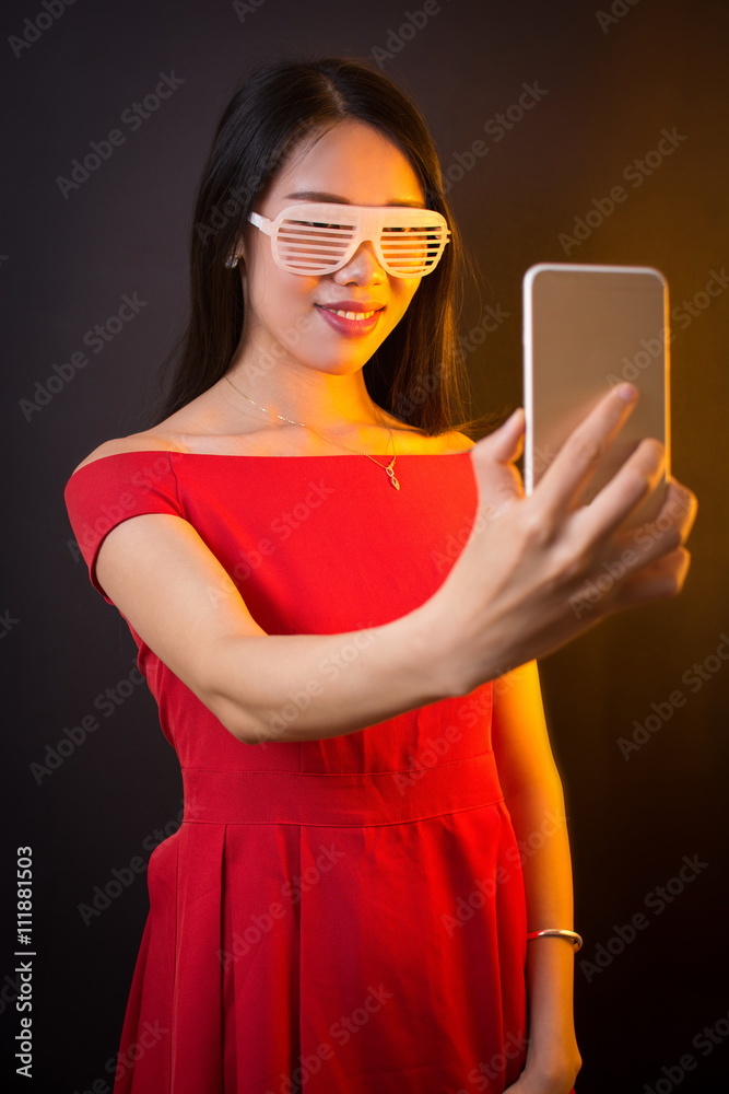 Young woman making selfie with smart phone