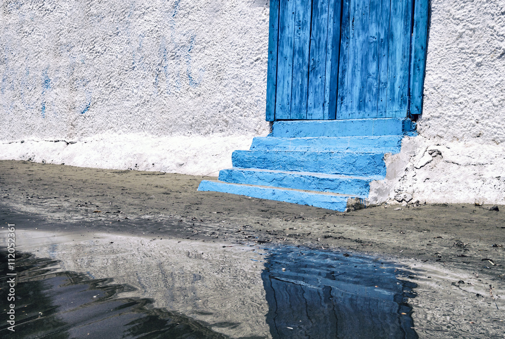 Blue entrance to beach house near the ocean