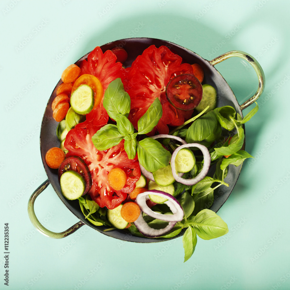 Fresh salad on blue background