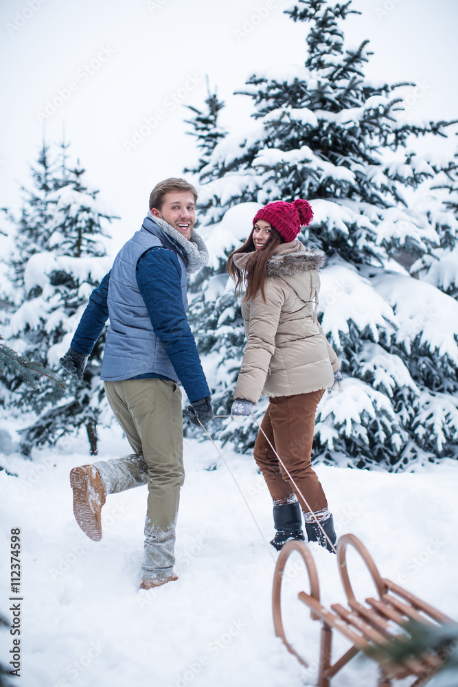 Young couple at winter forest