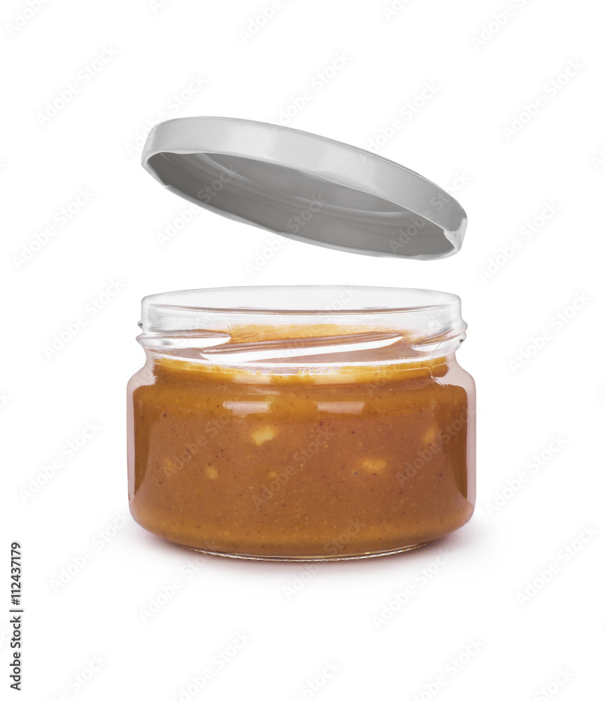 Jar of peanut butter isolated on a white background