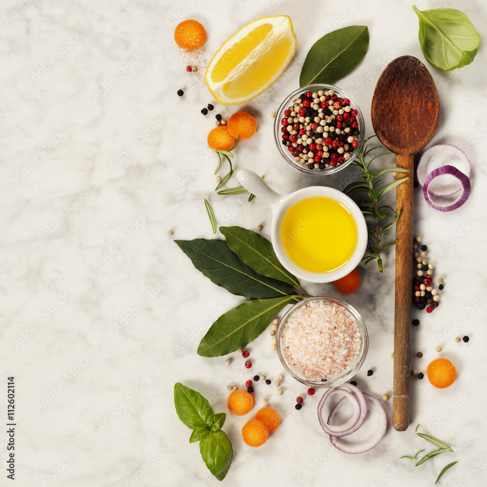 Wooden spoon and ingredients on marble background